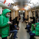 A courier for the Delivery Club service in Moscow rides an underground train on April 7.